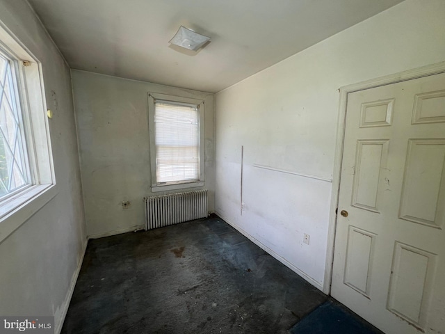 510 62nd Ave, Capitol Heights, MD 20743 - empty room featuring radiator, unfinished concrete floors, and baseboards