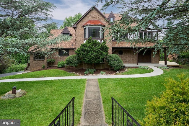 7423 Round Hill Rd, Frederick, MD 21702 - tudor-style house featuring brick siding