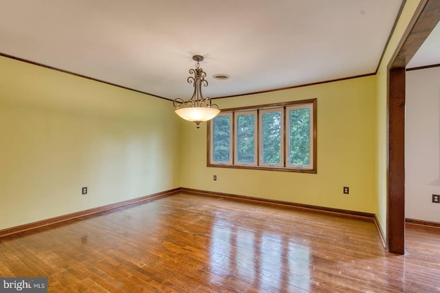 7423 Round Hill Rd, Frederick, MD 21702 - unfurnished room featuring wood finished floors, baseboards, and ornamental molding