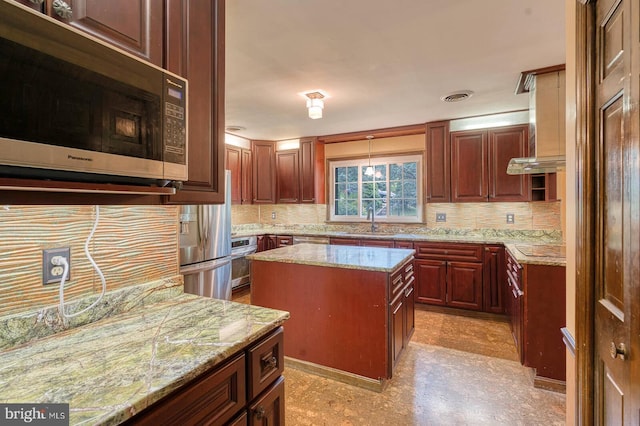 7423 Round Hill Rd, Frederick, MD 21702 - kitchen featuring stainless steel appliances, decorative backsplash, a kitchen island, and light stone countertops