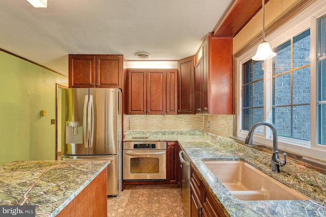 7423 Round Hill Rd, Frederick, MD 21702 - kitchen featuring stainless steel appliances, a sink, decorative light fixtures, decorative backsplash, and light stone countertops