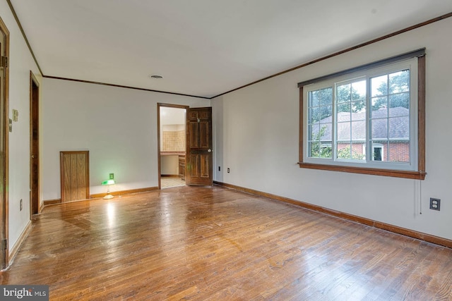 7423 Round Hill Rd, Frederick, MD 21702 - spare room featuring crown molding, wood finished floors, and baseboards