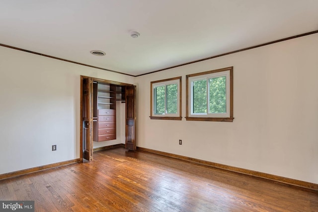 7423 Round Hill Rd, Frederick, MD 21702 - empty room featuring crown molding, dark wood-style flooring, baseboards, and a smoke detector
