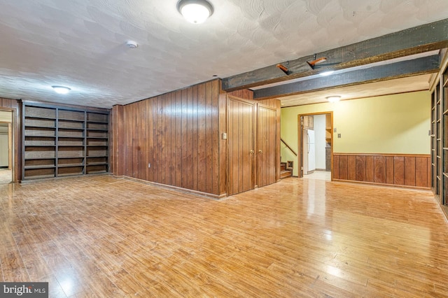 7423 Round Hill Rd, Frederick, MD 21702 - finished below grade area featuring freestanding refrigerator, wood walls, wood finished floors, stairway, and built in features