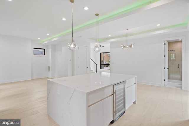 2007 S Joyce St, Arlington, VA 22202 - kitchen with wine cooler, recessed lighting, white cabinets, a center island, and open floor plan
