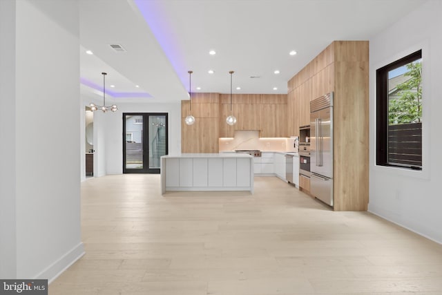 2007 S Joyce St, Arlington, VA 22202 - kitchen with modern cabinets, recessed lighting, baseboards, light countertops, and light wood-style floors