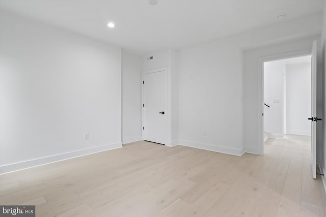 2007 S Joyce St, Arlington, VA 22202 - empty room with light wood-type flooring, baseboards, and recessed lighting