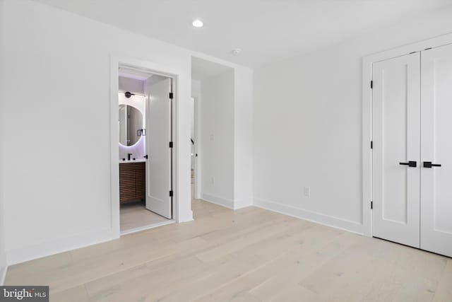 2007 S Joyce St, Arlington, VA 22202 - unfurnished bedroom featuring light wood-type flooring, recessed lighting, and baseboards