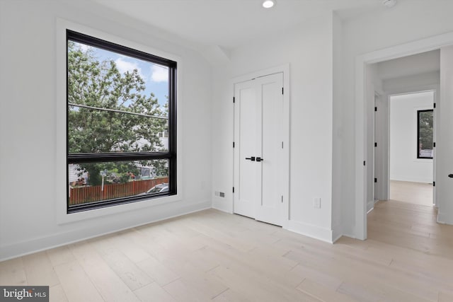 2007 S Joyce St, Arlington, VA 22202 - unfurnished bedroom with light wood-type flooring, baseboards, and recessed lighting