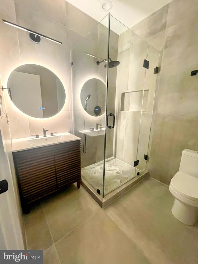 2007 S Joyce St, Arlington, VA 22202 - full bath with vanity, a shower stall, toilet, and tile patterned flooring
