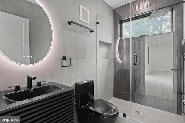 2007 S Joyce St, Arlington, VA 22202 - bathroom featuring a stall shower, vanity, tile walls, and toilet