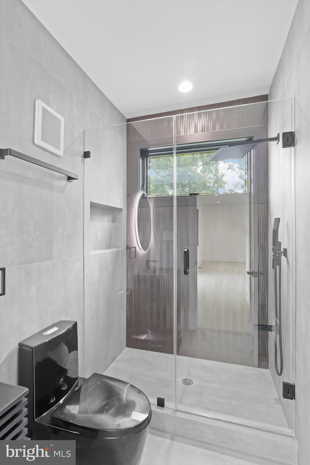 2007 S Joyce St, Arlington, VA 22202 - bathroom with a stall shower, toilet, and tile walls