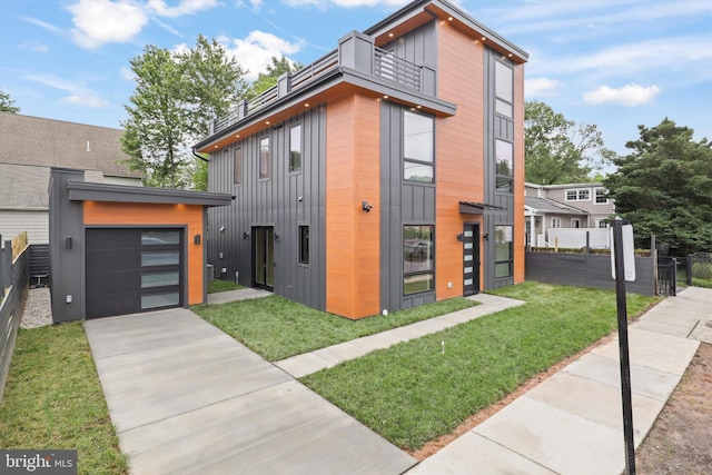 2007 S Joyce St, Arlington, VA 22202 - contemporary house featuring a balcony, driveway, and board and batten siding
