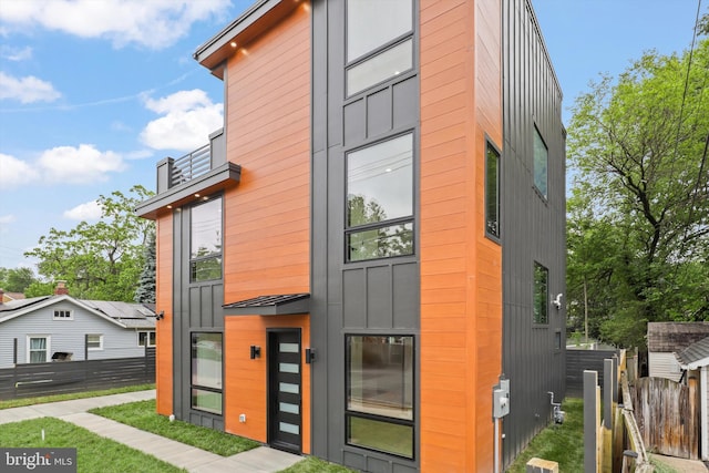 2007 S Joyce St, Arlington, VA 22202 - modern home with a balcony and board and batten siding