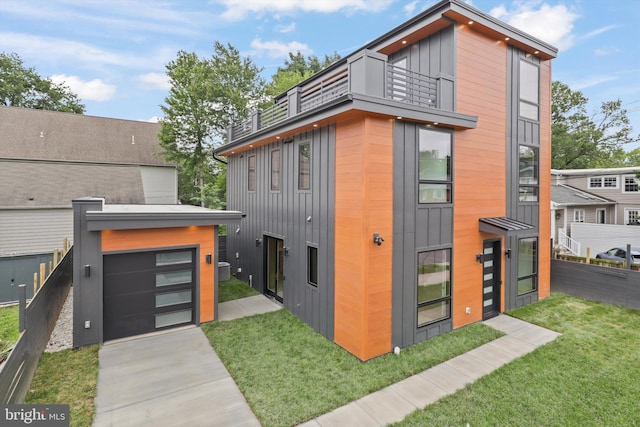 2007 S Joyce St, Arlington, VA 22202 - modern home featuring a balcony, driveway, and board and batten siding