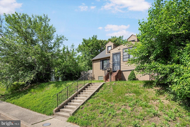 4406 Furley Ave, Baltimore, MD 21206 - view of front of home featuring a front lawn, stairs, and stucco siding