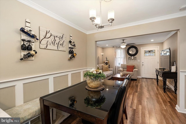 4406 Furley Ave, Baltimore, MD 21206 - dining room with crown molding, a chandelier, dark wood-style flooring, and ceiling fan