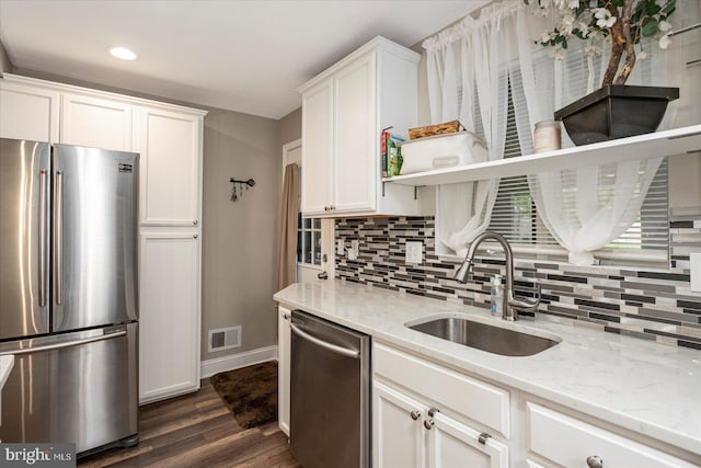 4406 Furley Ave, Baltimore, MD 21206 - kitchen with appliances with stainless steel finishes, a sink, open shelves, baseboards, and dark wood-style flooring