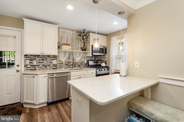 4406 Furley Ave, Baltimore, MD 21206 - kitchen featuring appliances with stainless steel finishes, a sink, backsplash, a peninsula, and white cabinetry