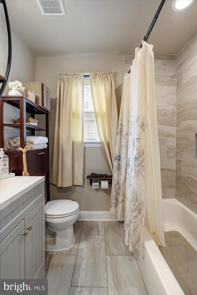 4406 Furley Ave, Baltimore, MD 21206 - bathroom featuring toilet, shower / tub combo with curtain, vanity, and baseboards
