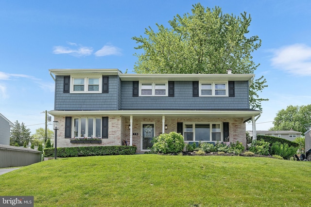 428 Hampshire Dr, Broomall, PA 19008 - view of front facade featuring a front yard, brick siding, and a porch
