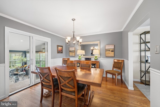428 Hampshire Dr, Broomall, PA 19008 - dining room featuring a chandelier, ornamental molding, wood finished floors, and a wainscoted wall