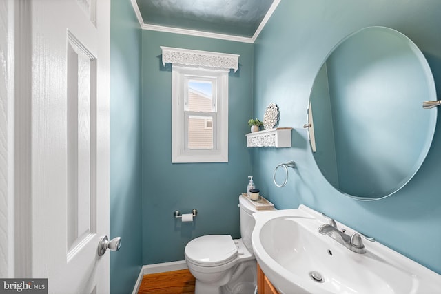 428 Hampshire Dr, Broomall, PA 19008 - bathroom featuring toilet, vanity, ornamental molding, baseboards, and wood finished floors