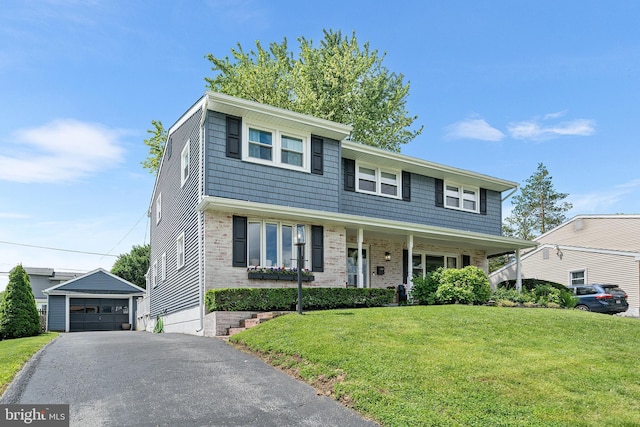 428 Hampshire Dr, Broomall, PA 19008 - view of front facade with an outdoor structure, a front lawn, a garage, and brick siding
