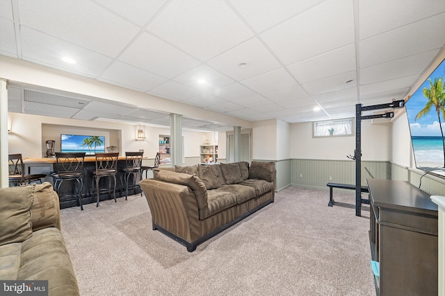 428 Hampshire Dr, Broomall, PA 19008 - carpeted living area featuring bar area, wainscoting, and a paneled ceiling