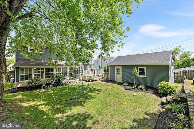 428 Hampshire Dr, Broomall, PA 19008 - view of yard featuring an outdoor structure and a wooden deck