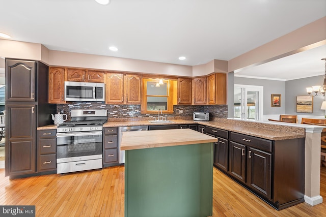 428 Hampshire Dr, Broomall, PA 19008 - kitchen with stainless steel appliances, butcher block countertops, a sink, a center island, and tasteful backsplash