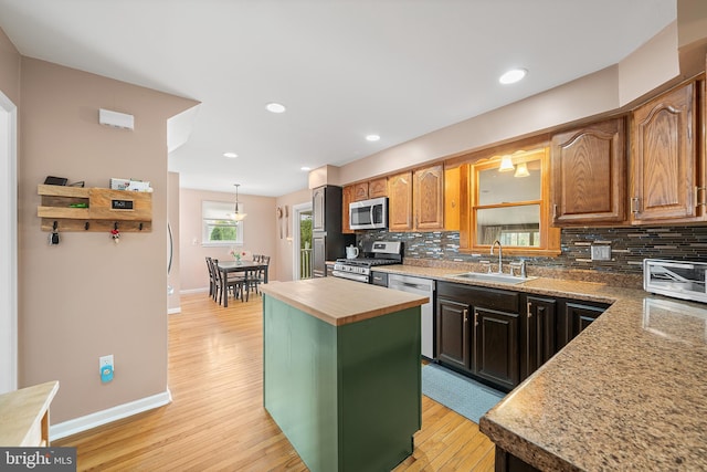 428 Hampshire Dr, Broomall, PA 19008 - kitchen featuring a sink, stainless steel appliances, baseboards, backsplash, and butcher block countertops