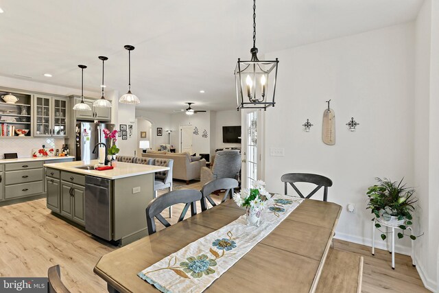 61 Stoners Cir, Littlestown, PA 17340 - dining space featuring light wood finished floors, ceiling fan, arched walkways, a chandelier, and recessed lighting