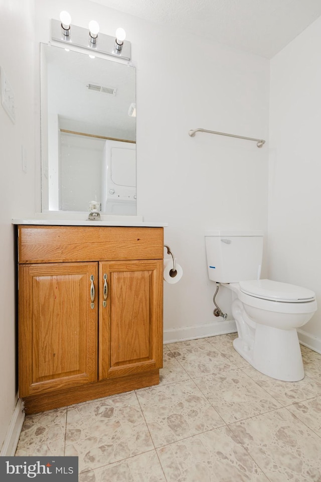 103 Stadium Cir, Inwood, WV 25428 - bathroom featuring toilet, vanity, baseboards, and tile patterned floors