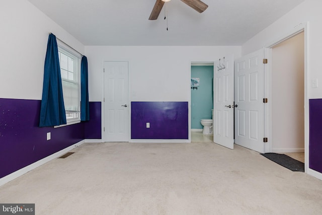 103 Stadium Cir, Inwood, WV 25428 - unfurnished bedroom featuring carpet flooring, baseboards, ensuite bathroom, and ceiling fan
