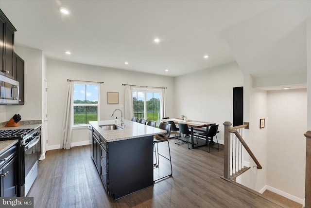 118 Fletcher Cir, Middletown, DE 19709 - kitchen featuring appliances with stainless steel finishes, a sink, an island with sink, dark wood-style floors, and recessed lighting