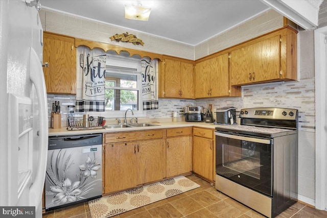 96 Messenger Ln, Willingboro, NJ 08046 - kitchen featuring stainless steel electric range oven, a sink, washer / dryer, white refrigerator with ice dispenser, and light countertops