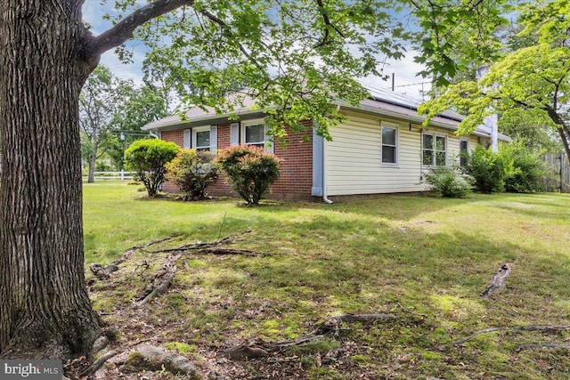 96 Messenger Ln, Willingboro, NJ 08046 - view of property exterior with solar panels and brick siding