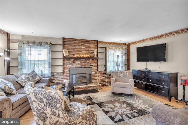 96 Messenger Ln, Willingboro, NJ 08046 - living room featuring wood finished floors and a wood stove