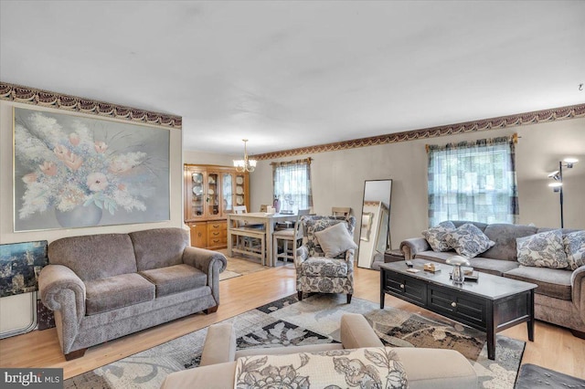 96 Messenger Ln, Willingboro, NJ 08046 - living room with a chandelier and light wood-style floors