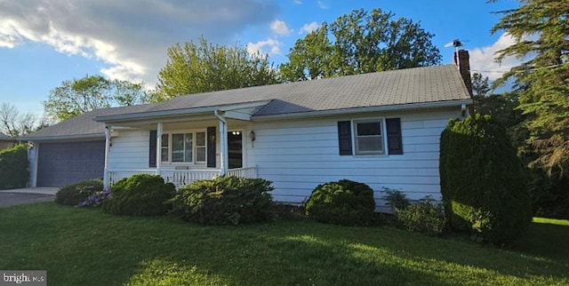 325 Clover Ln, Hanover, PA 17331 - single story home with a chimney, a front yard, a garage, covered porch, and driveway