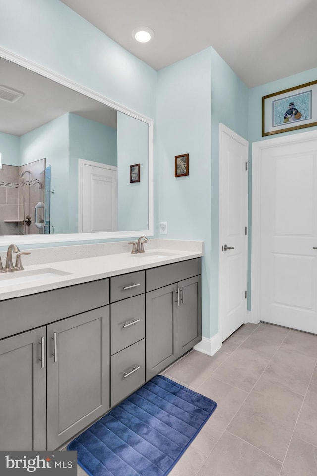 31107 Olney Way, Millsboro, DE 19966 - full bath featuring double vanity, a tile shower, tile patterned flooring, and baseboards
