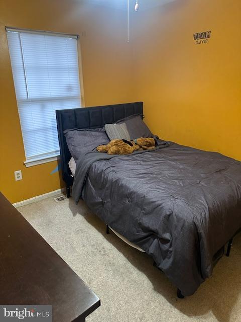 6708 Pauline Ct, Bryans Road, MD 20616 - carpeted bedroom featuring baseboards