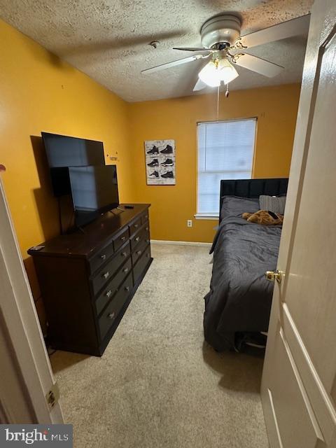 6708 Pauline Ct, Bryans Road, MD 20616 - bedroom featuring light colored carpet, a textured ceiling, baseboards, and a ceiling fan