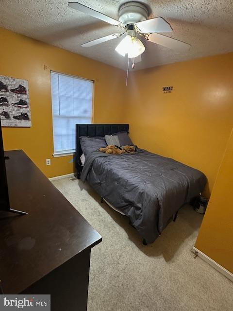 6708 Pauline Ct, Bryans Road, MD 20616 - bedroom featuring a textured ceiling, carpet floors, a ceiling fan, and baseboards
