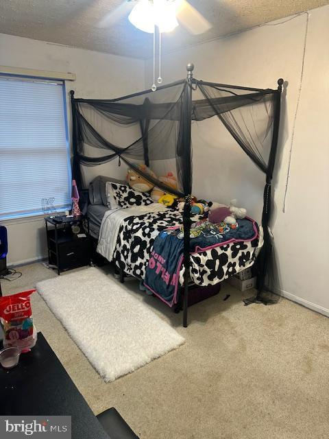 6708 Pauline Ct, Bryans Road, MD 20616 - carpeted bedroom featuring ceiling fan, baseboards, and a textured ceiling