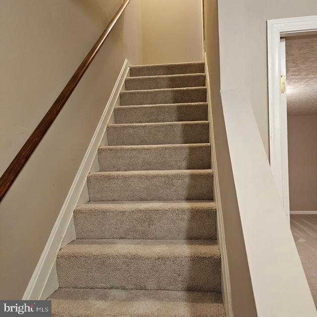 6708 Pauline Ct, Bryans Road, MD 20616 - staircase with baseboards