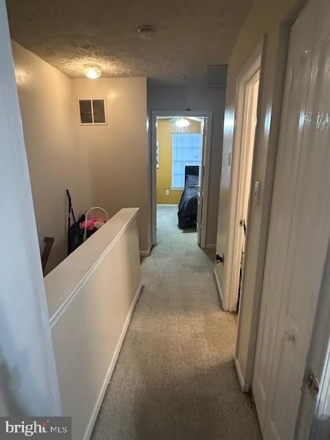 6708 Pauline Ct, Bryans Road, MD 20616 - corridor featuring light carpet and an upstairs landing