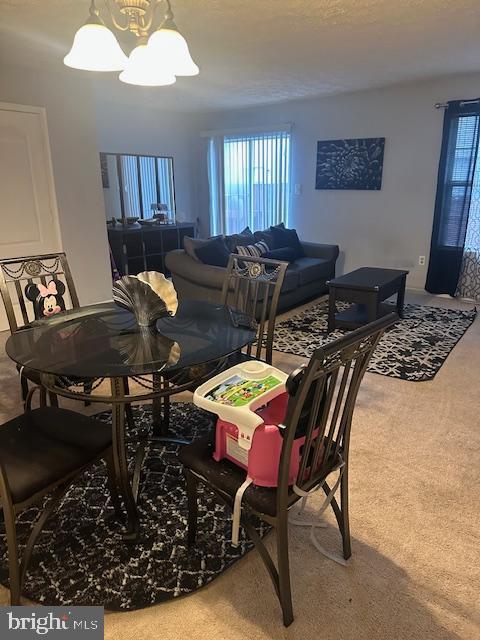 6708 Pauline Ct, Bryans Road, MD 20616 - dining space featuring a chandelier, carpet, and healthy amount of natural light