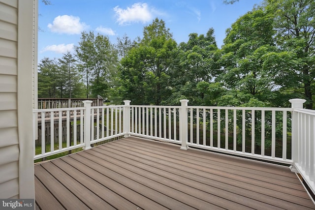 21748 Kings Crossing Ter, Ashburn, VA 20147 - wooden terrace with view of scattered trees